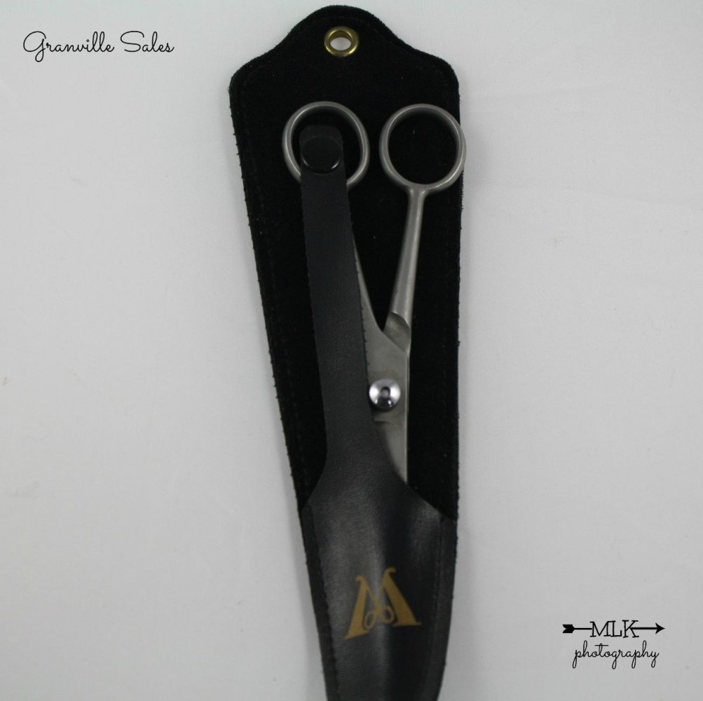 Scissors with an M logo 162